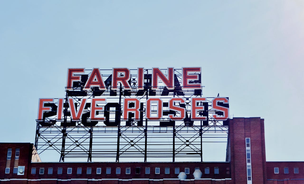View of the iconic Farine Five Roses sign against the blue sky in Montreal.